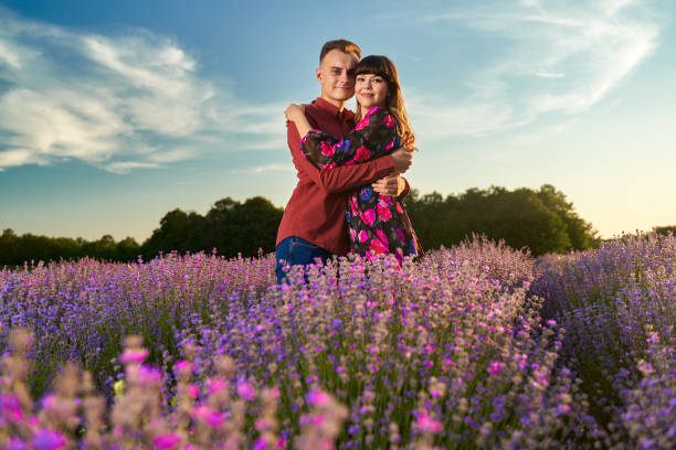 istock Young couple in a lavender field at sunset 1414984024