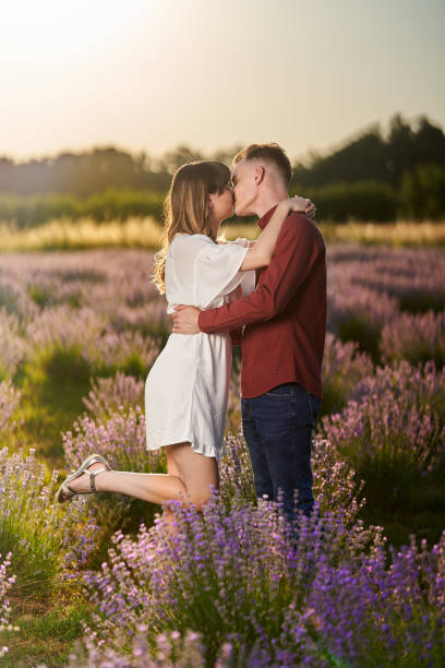 istock Young couple in a lavender field at sunset 1414984114