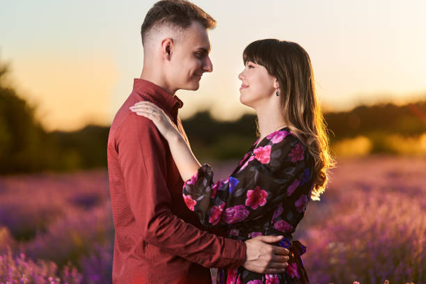 istock Young couple in a lavender field at sunset 1414984152
