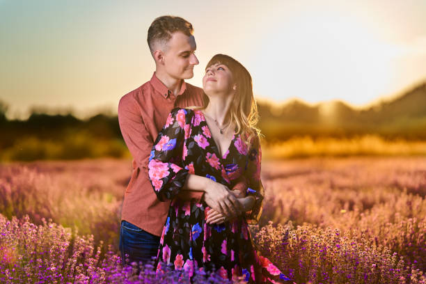 istock Young couple in a lavender field at sunset 1414984167