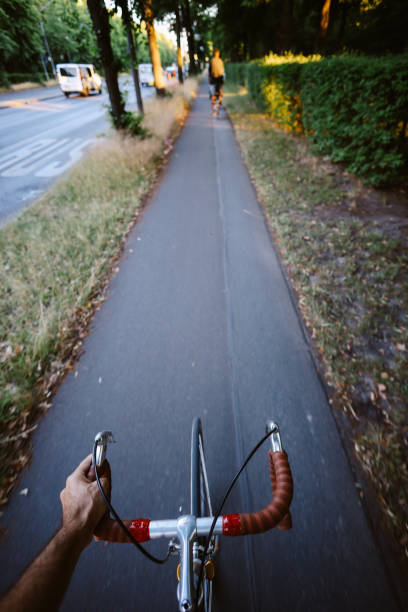 1st person view of a man cycling in Berlin Tiergarten.