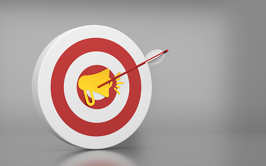 A hit Megaphone icon on the Dartboard and arrow on the Gray background. Success and Goal Concept.