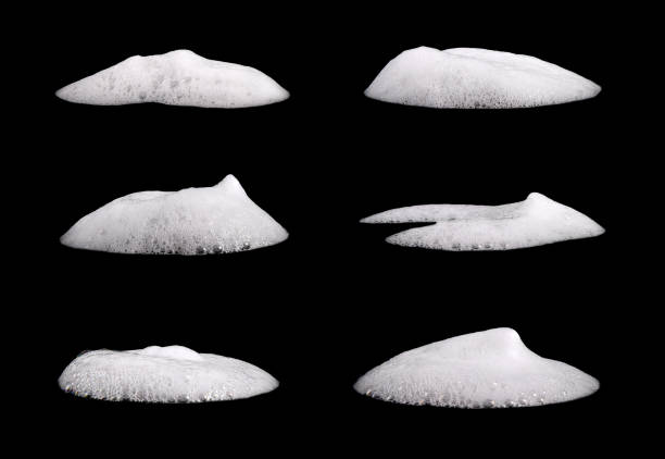istock Set liquid white foam from soap or shampoo or shower gel. Abstract bubbles. isolated on a black background 1414986597