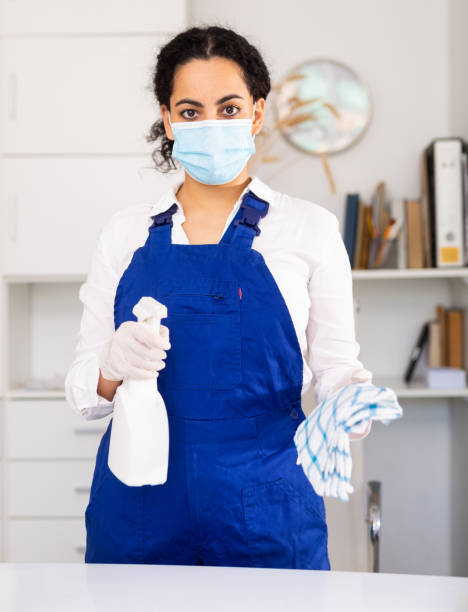 istock Woman cleaner in mask at office 1414987011