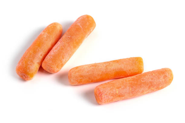 istock Baby frozen carrots on a white background 1414987721