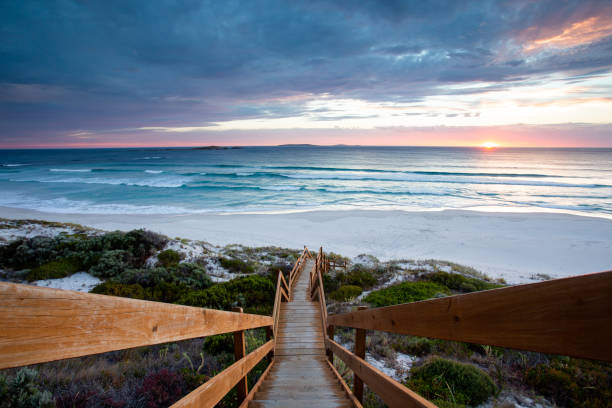 Beautiful image of sunset, stairs, sky, and beach in Esperance, Western Australia Beautiful image of sunset, stairs, sky, and beach in Esperance, Western Australia cape le grand national park stock pictures, royalty-free photos & images