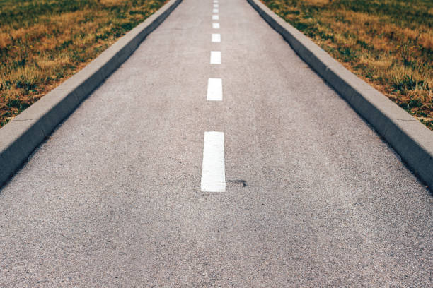 istock Asphalt bicycle land in diminishing perspective 1414988247