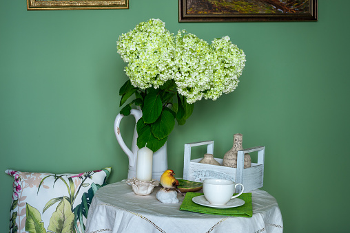 Table decor with hydrangea flowers, flower vases and candles