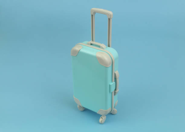 istock Travel suitcase or bag on blue background with copy space for text. 1414990213