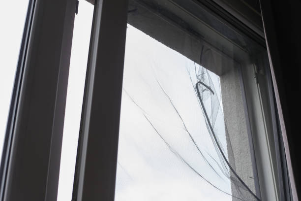 istock damaged mesh on the window. Window screens damaged by hail 1414994485