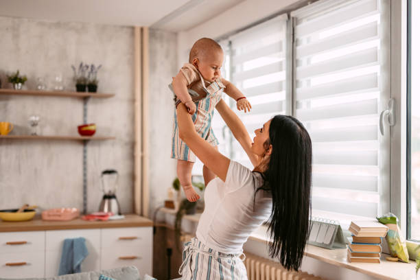 istock Young Mother Holding Her Baby 1414994516