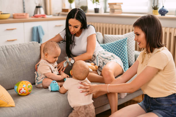 istock Two Young Mothers Having A Play Date With Their Baby Boys 1414994933