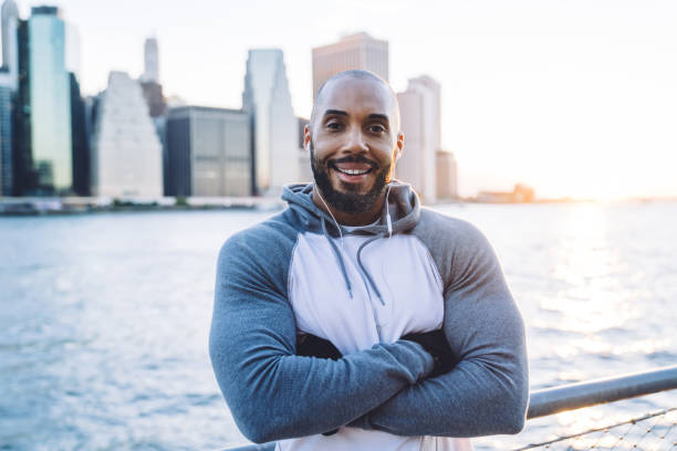istock African American bodybuilder relaxing on embankment 1414995342