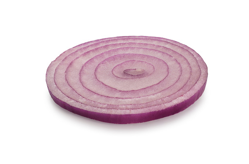 Studio shot of sliced red onion rings cut out against a white background.