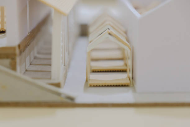 Super close up top view of sample architectural model of housing; macro view, selective focus.