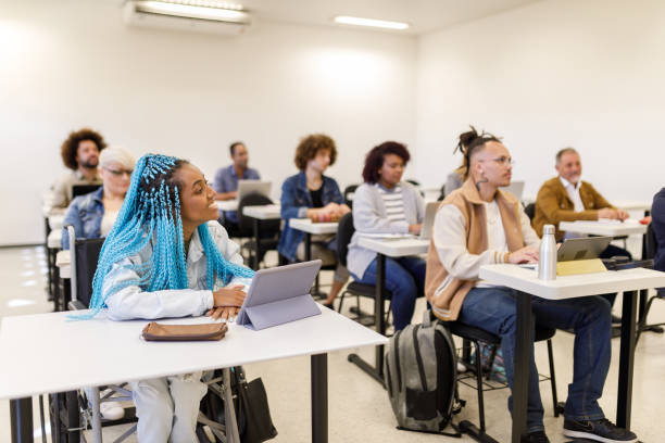 Focused students listening to class going back to school community college stock pictures, royalty-free photos & images