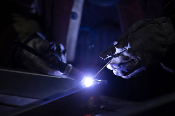 istock Weld a metal seam with argon arc welding. Welding works on metal. 1414996764