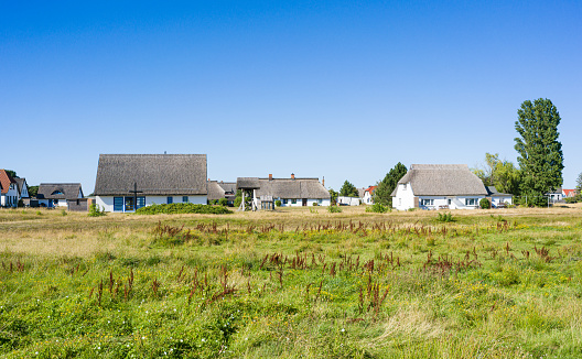 Panoramic view for typical houses with straw roof in small village Vitte on Hiddensee island, Germany.