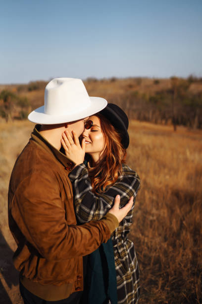 istock Lovely hipster couple resting in nature. 1414998344