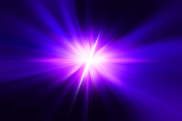 istock ultraviolet light. violet blue fire lighting flare bright shining on black blur abstract for background 1414998666