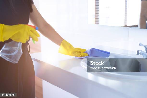 Maid Cleaning Basin Sink In Public Washroom With Cloth Clean Toilet With Glove Hygiene Home Stock Photo - Download Image Now