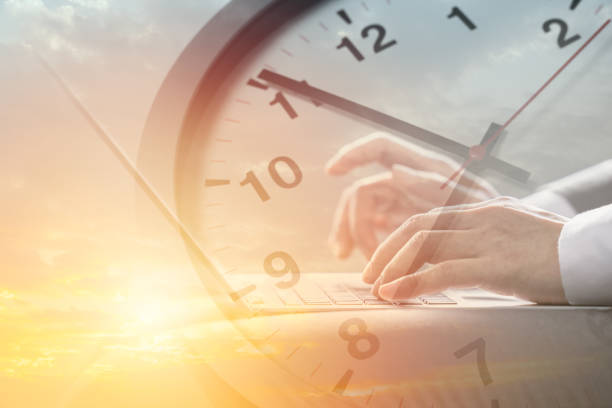 istock Business working times concept people work typing on laptop computer overlay with in time clock to lunch break 1414998813
