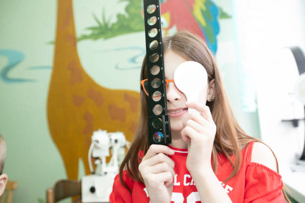 istock A little girl with visual impairment is being treated. 1414998871