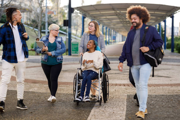 istock Group of students walking together on campus 1414999007