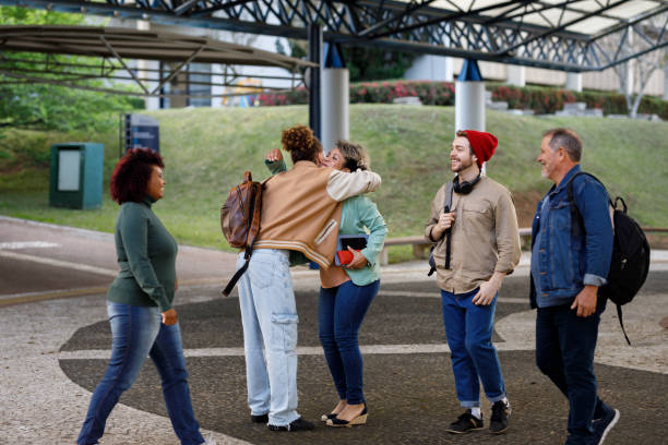 istock Students greeting each other when  arriving on campus 1414999008