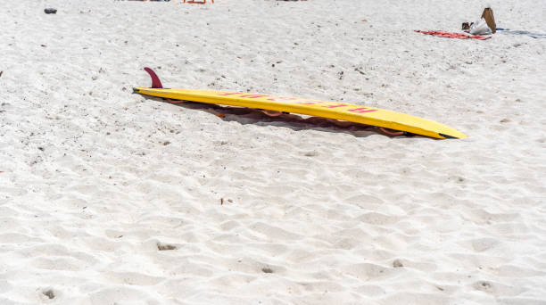 istock Rescue surfboard on Bahamas beach 1415000442