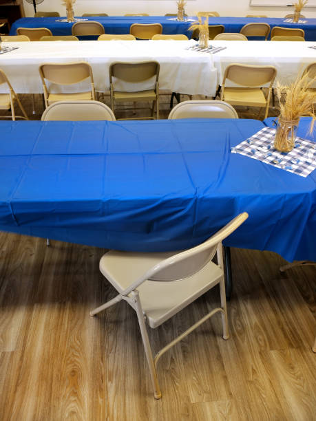 istock Tables and Chairs Set up for a Party Blue and White Tablecloth Table Cloth 1415000806