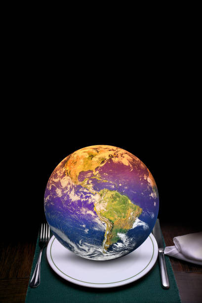 istock Environmental issues an global crises concept of World on dining table 1415002455
