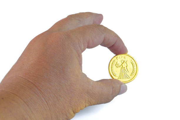 istock Golden coins money  in hand on background. 1415003230