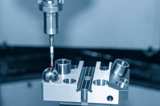 istock The CMM probe calibration operation with sphere ball part. 1415003615