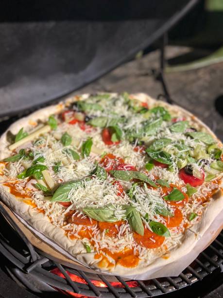 istock A homemade pizza cooking on a grill 1415003919