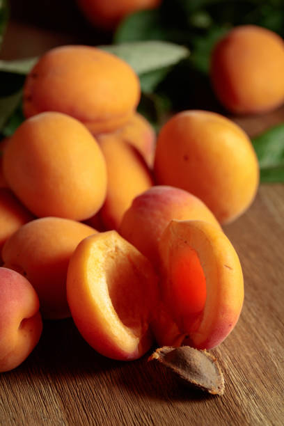 istock Apricots on a wooden table. 1415006630