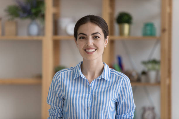 istock Attractive businesslady pose at workplace smile look at camera 1415007098