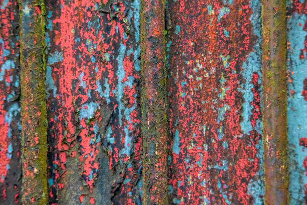 Abstract textured background of peeling paint on rusty metal.