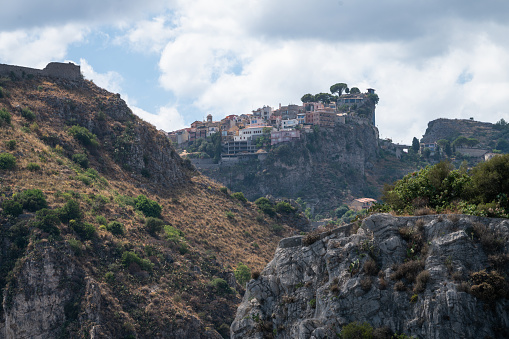 Aerial view overlooking the city of Taormina in Sicily, Italy. Seen a hot summer day.