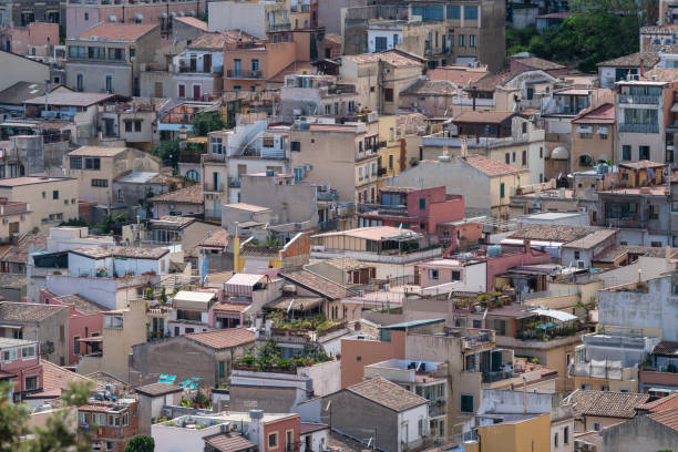 Aerial view overlooking the city of Taormina in Sicily, Italy. Seen a hot summer day.