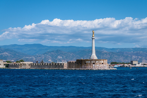 The golden statue is 7 meters high and guards the city and the port of Messina.