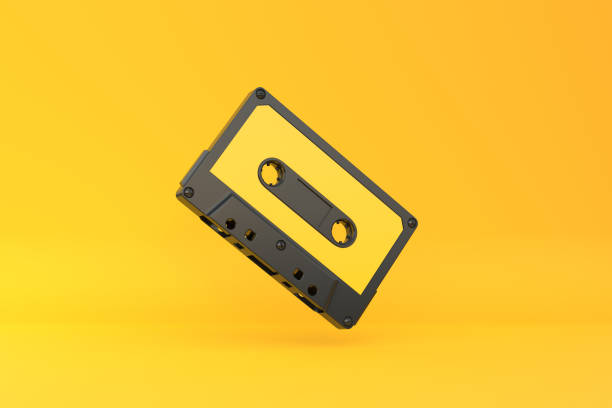 istock Vintage audio tape cassette on a yellow background 1415016876