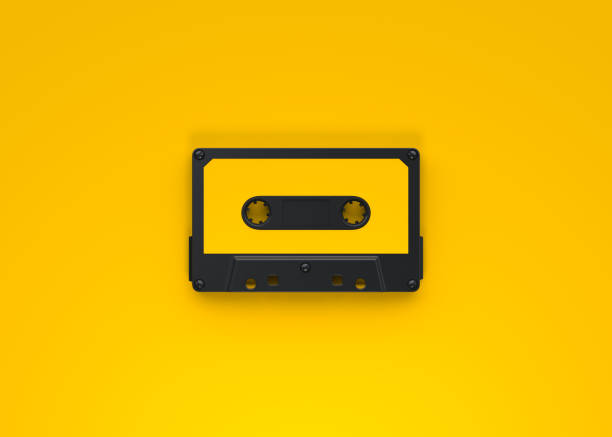 istock Vintage audio tape cassette on a yellow background 1415016877
