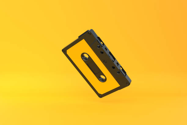 istock Vintage audio tape cassette on a yellow background 1415016929