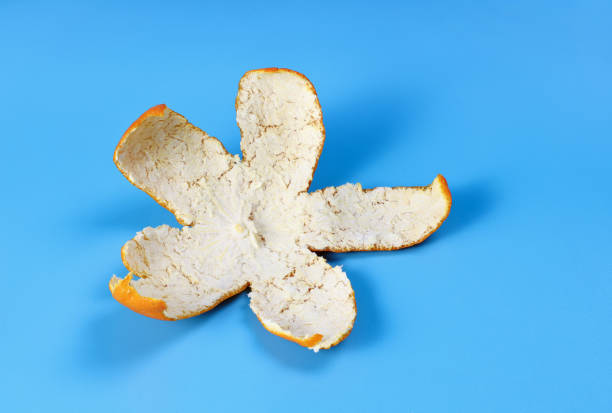 istock Mandarin peel on a blue background close-up 1415017218