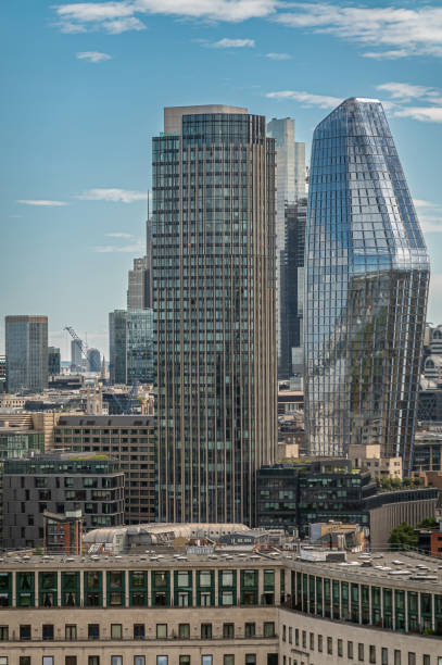 One Blackfriars  glass tower, Seen from London Eye, England London, UK - July 4, 2022: Seen from London Eye. One Blackfriars high rise modern glass residential building and South Bank Tower left in urban cityscape under blue cloudscape. bankside photos stock pictures, royalty-free photos & images