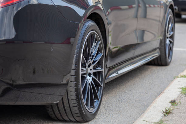 istock Black executive car stands in the parking lot 1415018396