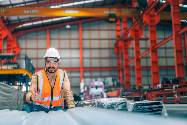 istock Portrait professional confident Asian man industrial engineer/worker/technician with safety hardhat are check, inspect metal sheet for quality control in production steel manufacture factory plant 1415018768