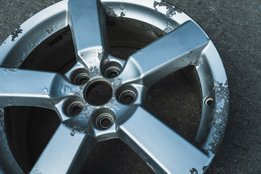 Corrosion on a silver aluminum alloy wheel close-up