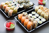 Sushi roll in plastic box for take away background
